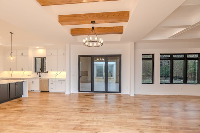 interior space featuring sink, a notable chandelier, beam ceiling, and light hardwood / wood-style flooring