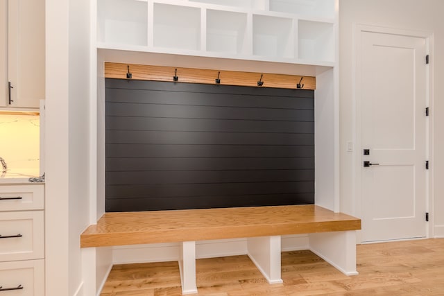 mudroom with light hardwood / wood-style flooring