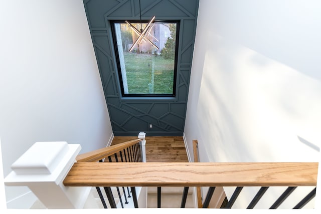 stairway featuring wood-type flooring