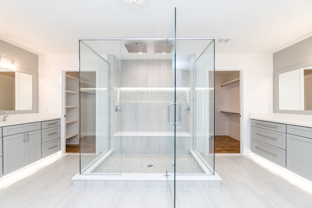 bathroom with vanity and an enclosed shower