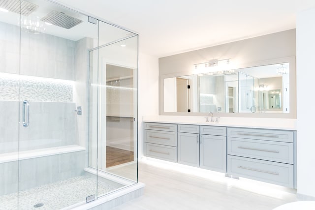 bathroom with vanity and walk in shower