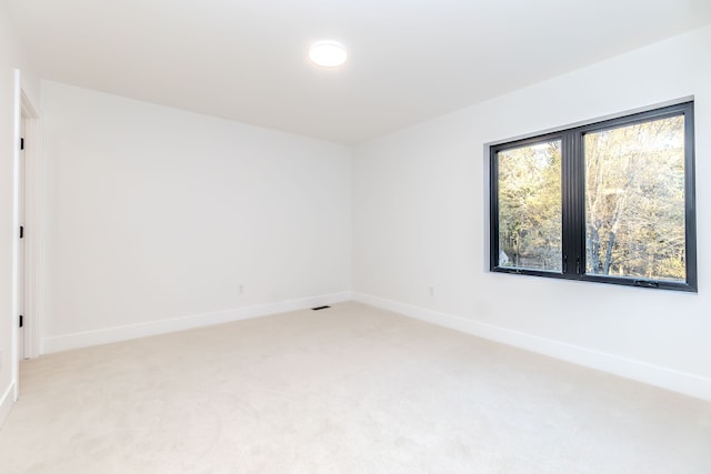 empty room with light colored carpet