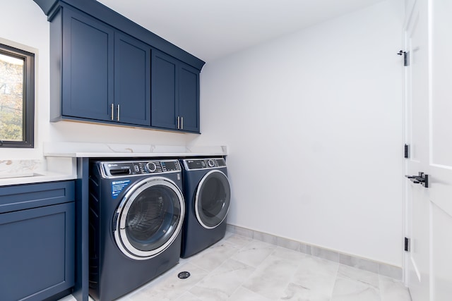 washroom with cabinets and independent washer and dryer