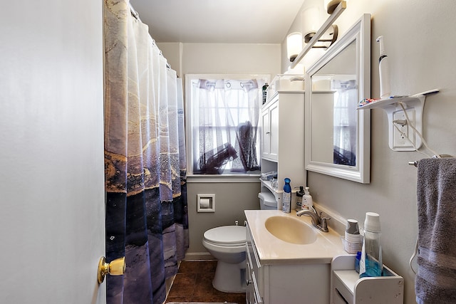 bathroom with tile patterned floors, toilet, vanity, and a shower with shower curtain