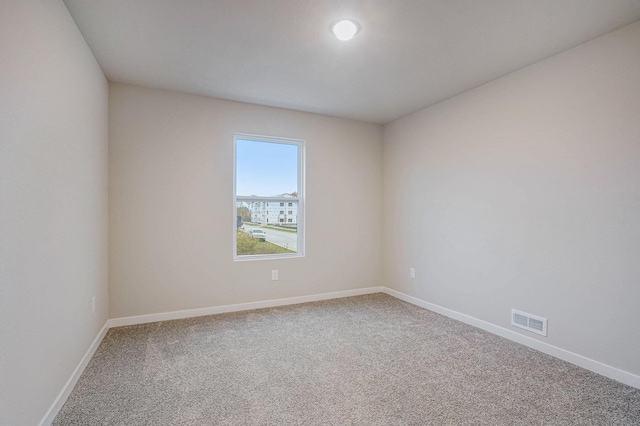 unfurnished room featuring carpet flooring