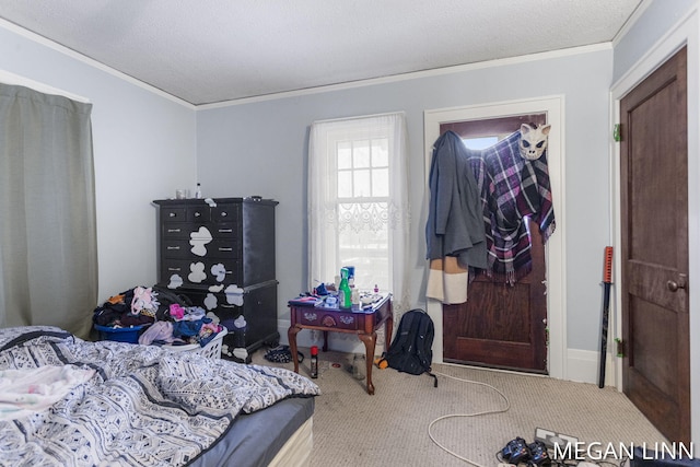 carpeted bedroom with ornamental molding and a textured ceiling