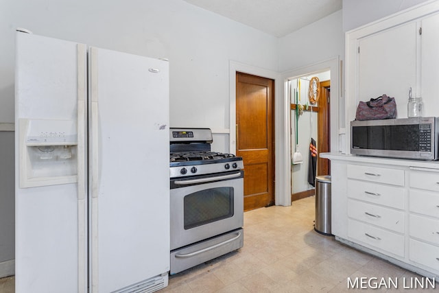 kitchen featuring white cabinetry and appliances with stainless steel finishes