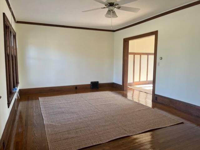 unfurnished room featuring hardwood / wood-style floors, ornamental molding, and ceiling fan