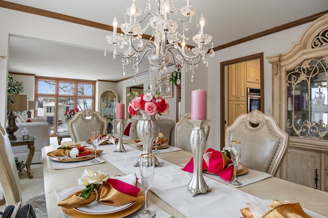 dining room with a notable chandelier and crown molding