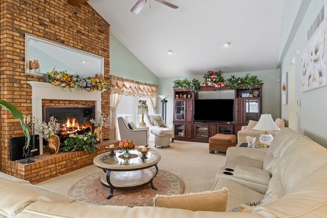 living room with light carpet, a brick fireplace, ceiling fan, and high vaulted ceiling