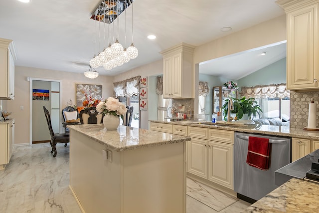 kitchen with a center island, marble finish floor, hanging light fixtures, cream cabinets, and dishwasher