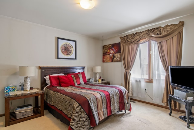 bedroom featuring light carpet and baseboards