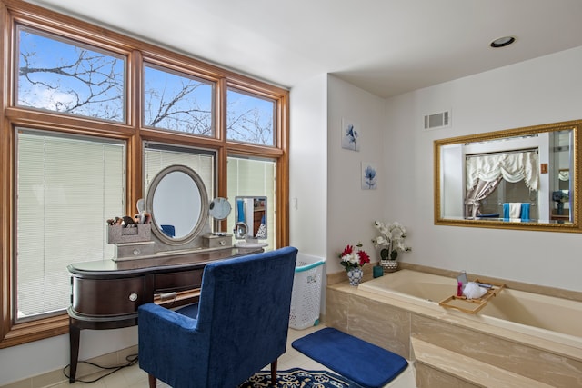 interior space featuring a garden tub and visible vents