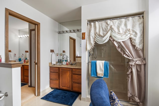 bathroom with a stall shower and vanity