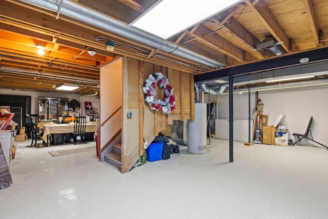 unfinished below grade area featuring gas water heater and stairway