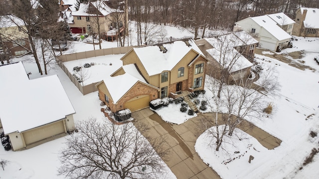 snowy aerial view featuring a residential view