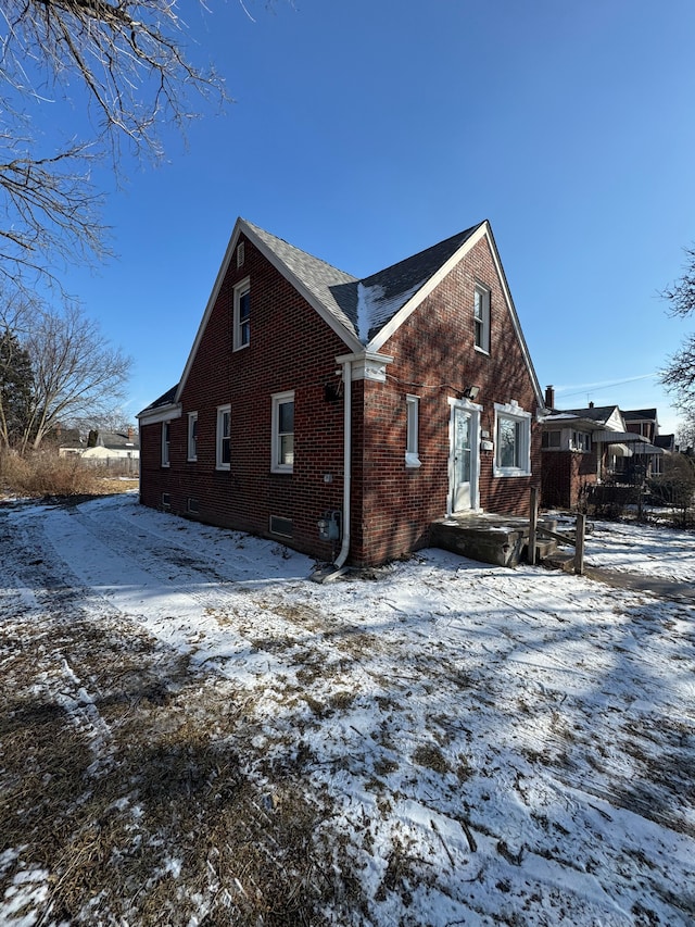 view of snow covered property