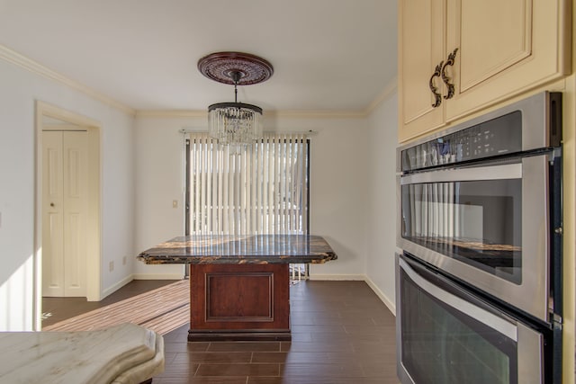 kitchen featuring pendant lighting, crown molding, double oven, wood tiled floor, and baseboards