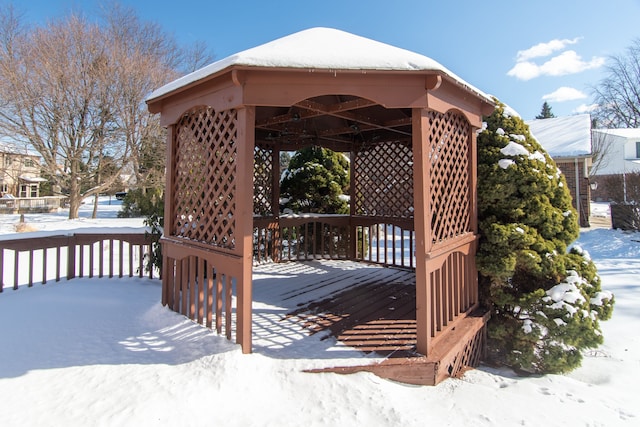 snow covered deck featuring a gazebo