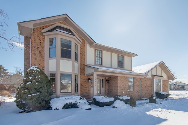 view of front of home featuring brick siding