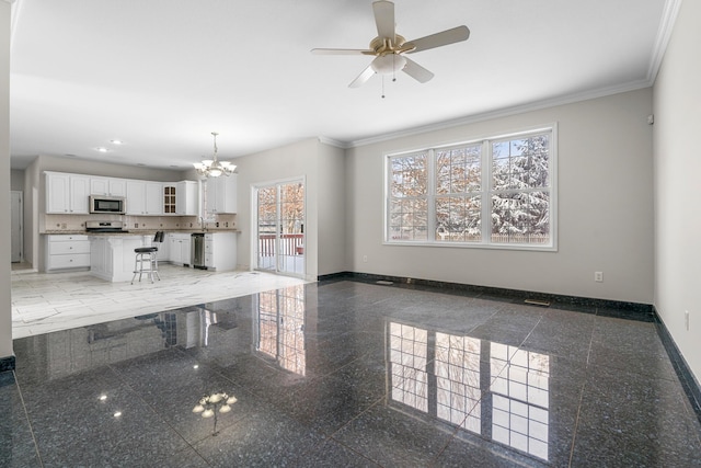 kitchen with a breakfast bar, appliances with stainless steel finishes, white cabinetry, hanging light fixtures, and ornamental molding