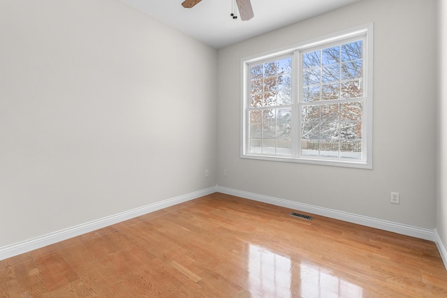 empty room featuring light hardwood / wood-style floors and ceiling fan