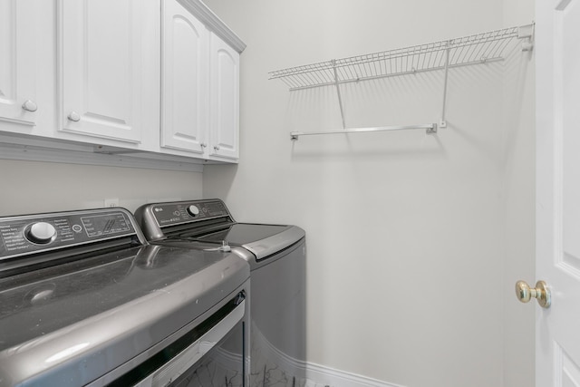 laundry area with cabinets and independent washer and dryer