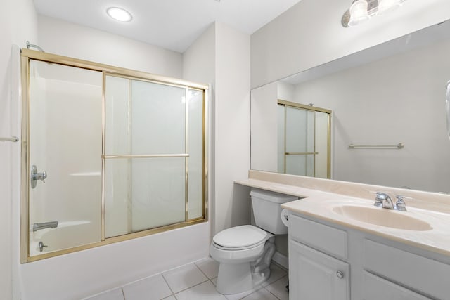 full bathroom with vanity, tile patterned floors, toilet, and combined bath / shower with glass door