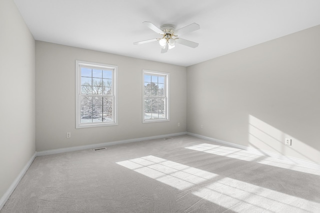 carpeted empty room with ceiling fan