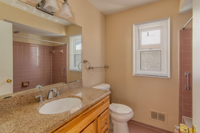 bathroom with toilet, visible vents, a wealth of natural light, and vanity