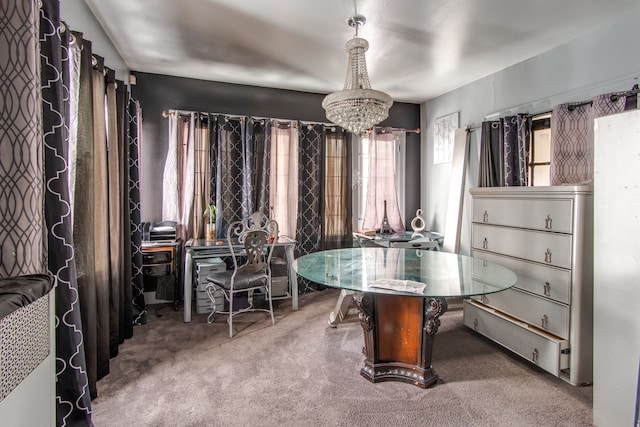 dining room with carpet floors and an inviting chandelier