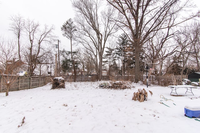 view of yard layered in snow