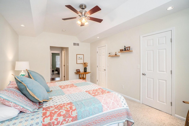 bedroom with ceiling fan, light colored carpet, and lofted ceiling