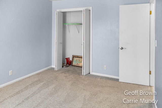 unfurnished bedroom featuring a closet and carpet