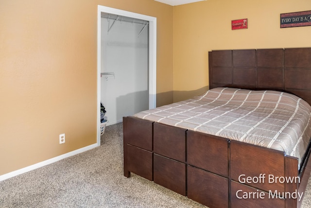 unfurnished bedroom featuring light carpet and a closet