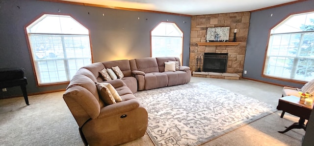 living room featuring baseboards, carpet, and a stone fireplace