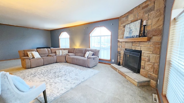 carpeted living room featuring visible vents and a fireplace