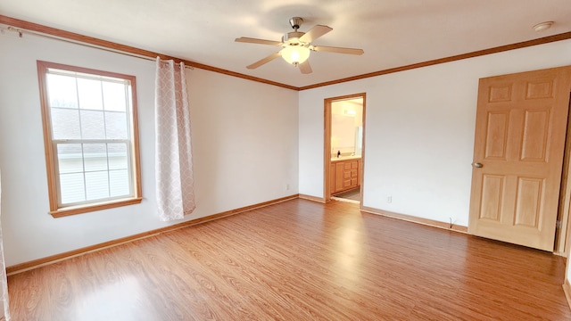 unfurnished room featuring a ceiling fan, baseboards, light wood finished floors, and ornamental molding