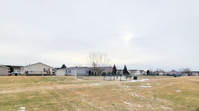 view of yard featuring a residential view and fence