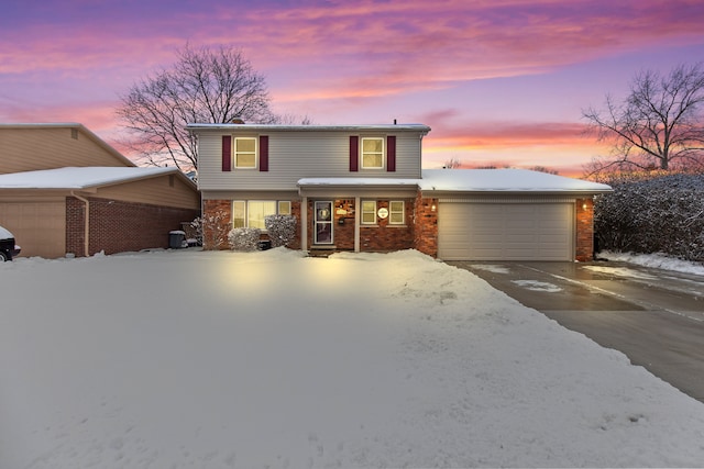 front facade with a garage