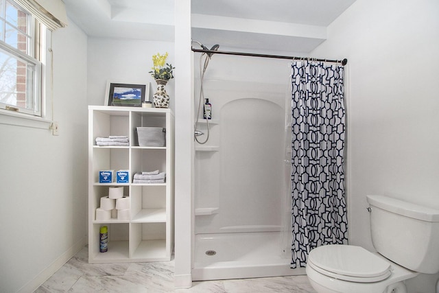 full bathroom with toilet, marble finish floor, baseboards, and a stall shower