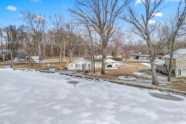 view of yard layered in snow