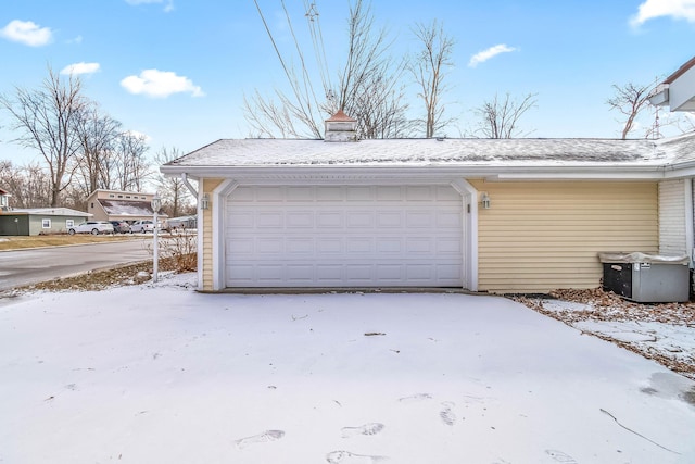 view of snow covered garage