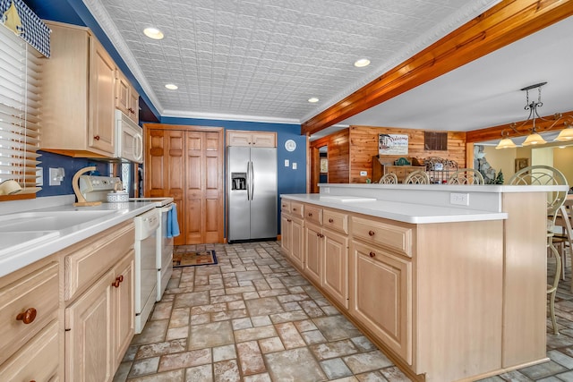 kitchen featuring pendant lighting, white appliances, a kitchen breakfast bar, and light brown cabinetry