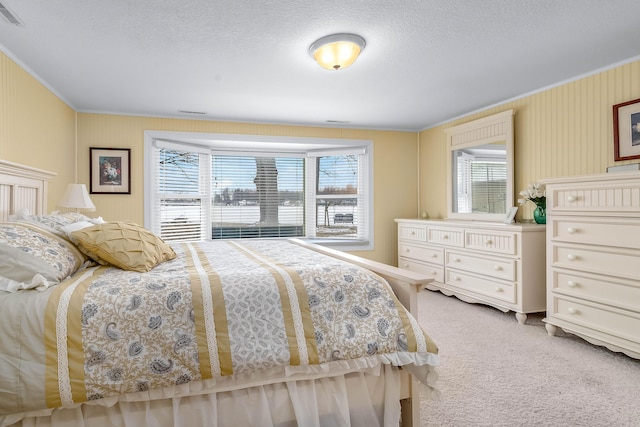 carpeted bedroom with crown molding, multiple windows, and a textured ceiling