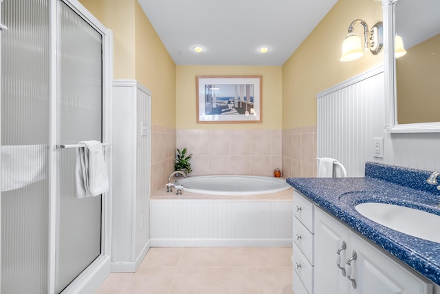 bathroom featuring vanity, tile patterned floors, and plus walk in shower