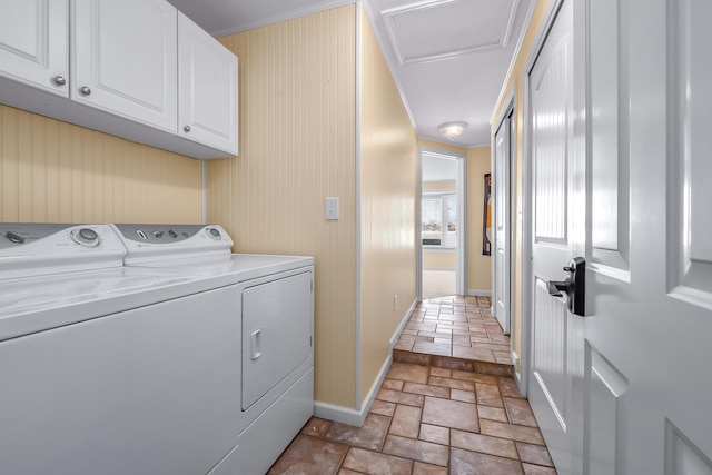 laundry room with cabinets and washing machine and clothes dryer