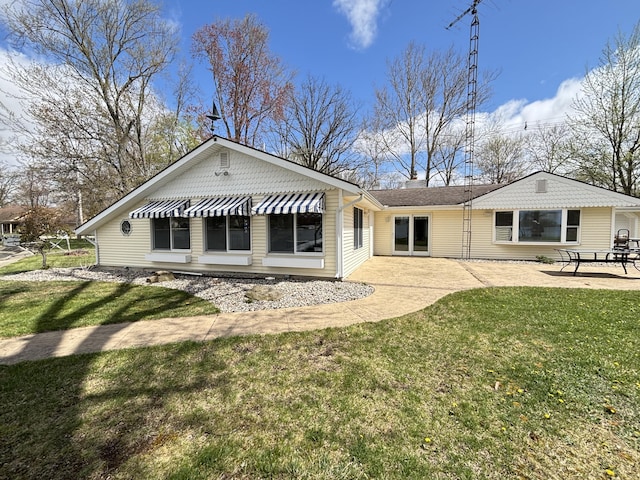 509 Warren Rd, Coldwater, MI 49036 - back of house with a lawn, a patio, and a chimney