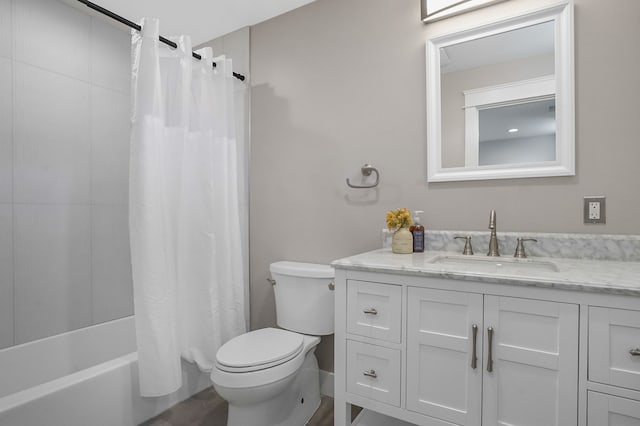 full bath featuring shower / bathtub combination with curtain, vanity, and toilet