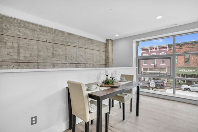 dining area with recessed lighting, visible vents, and wood finished floors